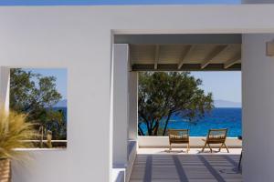 a view of the ocean from the front porch of a house at Acron Vigla in Mikri Vigla