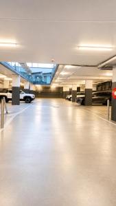 an empty parking garage with cars parked in it at Belmercer Motel in Geelong