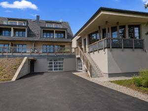 a house with a driveway in front of it at Apartmán PERLA 28 Říčky v Orlických horách in Říčky