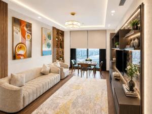 a living room with a couch and a table at AsiaWay Apartment-NEST ONE in Tashkent