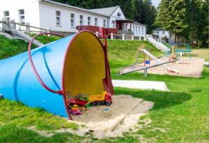 a playground with a slide and a play structure at Sauberghaus Wohnung 1 in Breitenbrunn