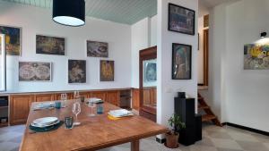 a dining room with a wooden table in a room at Laurus Home Restaurant B&B Cilento in Trentinara +18 photos