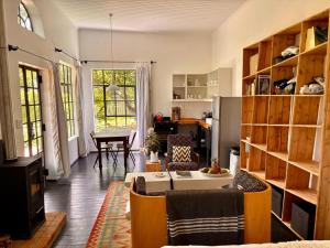 a living room with a couch and a table at Field Cabin in Rosendal