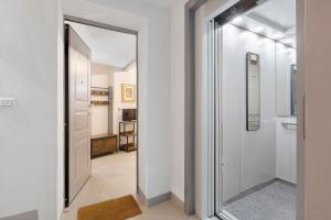a hallway with a door leading to a bathroom at Maison Jaccod Apartments in Morgex +79 photos