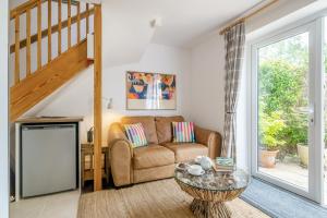 a living room with a couch and a table at 1 Bed in Taunton oc-75135 in Isle Brewers