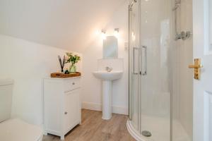 a white bathroom with a sink and a shower at 1 Bed in Taunton oc-75135 in Isle Brewers +18 photos
