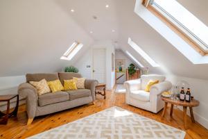 a living room with a couch and two chairs at 1 Bed in Taunton oc-75135 in Isle Brewers