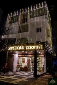a building with a sign that reads sweeper executive at Sweekar Executive in Tuljapur +8 photos