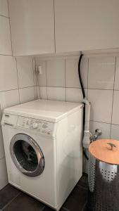 a washer and dryer in a small room at Charming Casa Hauge BB Sunset Room in Sandane