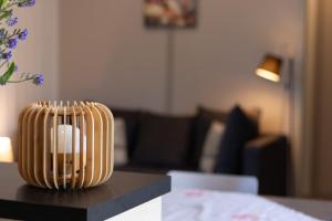 a vase sitting on top of a table at Delya, chalet confort, climatisation, piscine in Agde