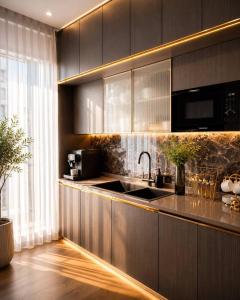 a kitchen with a sink and a counter top at AsiaWay Apartment-NEST ONE in Tashkent