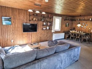 a living room with a couch and a table at Apartment Crap Grisch by Interhome in Ruschein