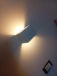 a light on a wall with a box on it at Sabry holiday Terrasini in Terrasini