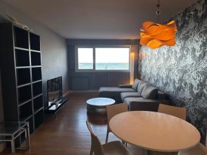 a living room with a couch and a table at Samsara in San Sebastián