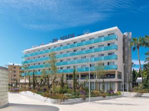 a building with a sign on the top of it at H10 Delfín - Adults Only in Salou