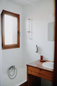 a bathroom with a sink and a mirror at Auberge d'Anthy in Anthy