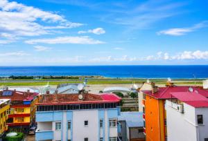 a view of the ocean from a building at Blue61 Residence Airport in Pelitli