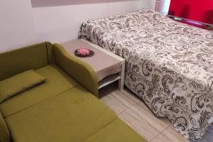 a room with a bed and a table with a bowl on it at Promar La Pineda Port Aventura in La Pineda +31 photos