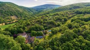 an aerial view of a house in the mountains at Grésigne in Larroque