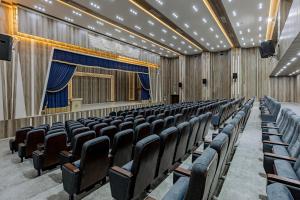 an empty auditorium with chairs and a stage at Obelisk Nile Towers in Aswan