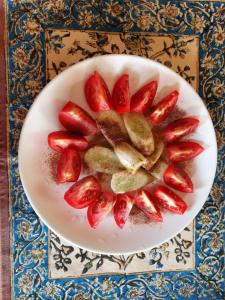 a plate of strawberries on a table at Rumis Jaisalmer in Jaisalmer