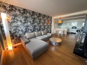 a living room with a couch and a table at Samsara in San Sebastián