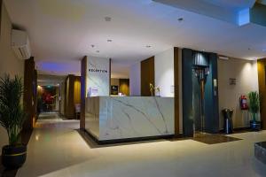 a lobby of a hotel with a marble counter at Nawara Dala - Economic in Riyadh