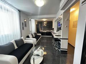 a living room with a couch and a table at Apartment Decumana in Krk