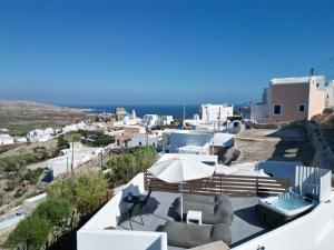 a view of a city from the roof of a house at Villa Solasta #2 with jacuzzi in Santorini in Akrotiri
