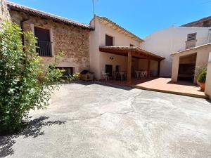 a house with a large driveway in front of it at Casa Remedios in Cubla