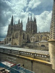 a large cathedral with a train in front of it at Burgos Spa and Cathedral in Burgos