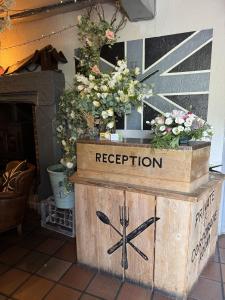 a wooden crate with a reporation sign on it at The Chequers at Burcot in Oxford +8 photos