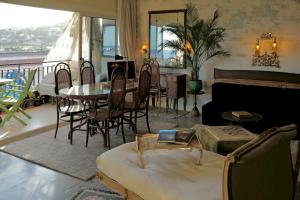 a living room with a couch and a table at Seaview Beach Residence Malgrat de Mar in Malgrat de Mar