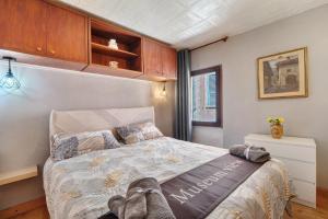 a bedroom with a large bed in a room at Museum view, Vista sul museo B in Sassello