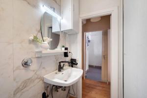 a bathroom with a sink and a mirror at Museum view, Vista sul museo B in Sassello