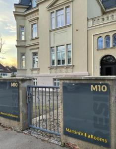 a mmo sign in front of a house at MartiniRoom Signature in Glauchau