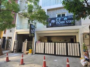 a group of orange cones in front of a house at GT Homestay in Chennai