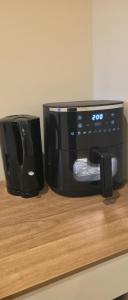 a black coffee maker sitting on top of a counter at West Beck House Darlington - Penthouse Double En-Suite in Darlington
