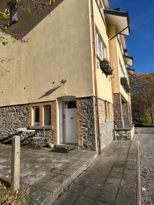 a building with a door on the side of it at Studio Rue de Pommard in Francorchamps