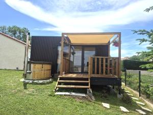 a tiny house in a yard with a gazebo at Douce Escale in Vichel +9 photos