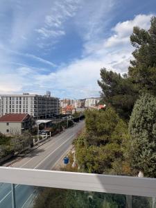 a view of a city street from a balcony at Hotel-Bar-Riviera in Lezhë +32 photos