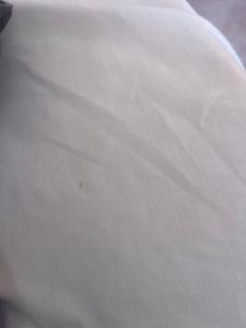 a close up of a white bedsheet at Parnes luxury in Al Mudawwarah