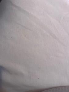 a close up of a white bedsheet at Parnes luxury in Al Mudawwarah