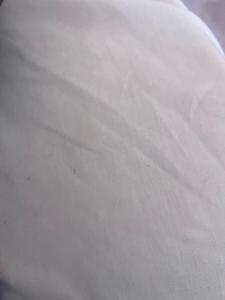 a close up of a white bedsheet at Parnes luxury in Al Mudawwarah
