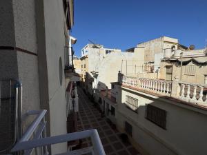 a view of an alley between two buildings at Turquesa Zon & Strand Carihuela in Torremolinos