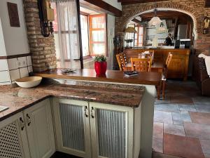 a kitchen with a counter top in a room at Casa La Campa in Comillas