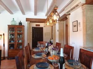 a dining room with a table with chairs and a chandelier at Villa Villa Lantana by Interhome in Jávea