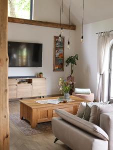a living room with a couch and a coffee table at Chlewiska nad Świnką in Narol