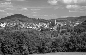 a black and white photo of a town in the hills at Apartment Huckelberg in Schmallenberg