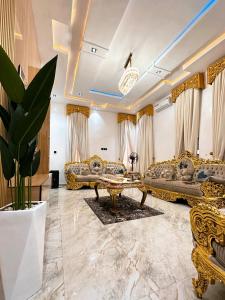 a living room with couches and a table at The Movia Residences 1 in Enugu